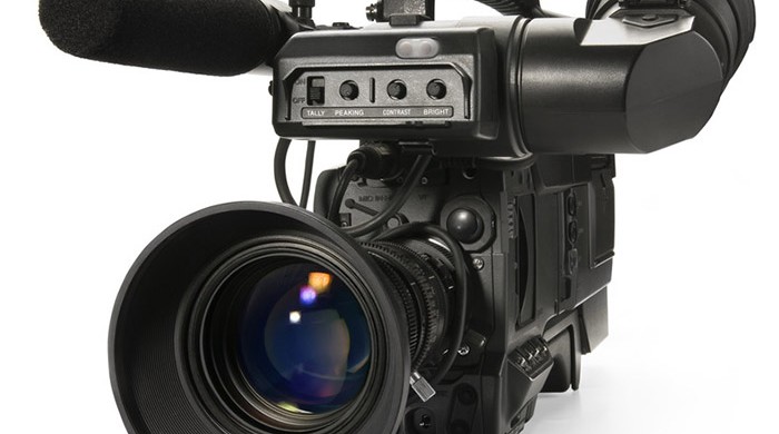 Professional digital video camera, isolated on white background